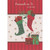 Red and Green Stockings and Gifts Over Sparkling White Glitter Spanish Language Thinking of You Christmas Card: Pensando en Ti en Navidad (English: Thinking of You at Christmas)