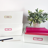 Reusable rectangle write-on labels on office supply containers