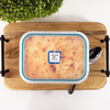 Square write-on labels on freezer meal labeled with cook time and temperature