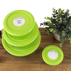 Round write-on labels on food containers labeled with contents and date