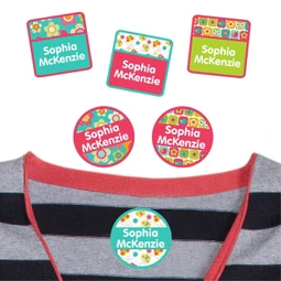 All Things Spring summer camp labels applied to a fabric shirt.
