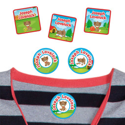 Puppies summer camp labels applied to a shirt.