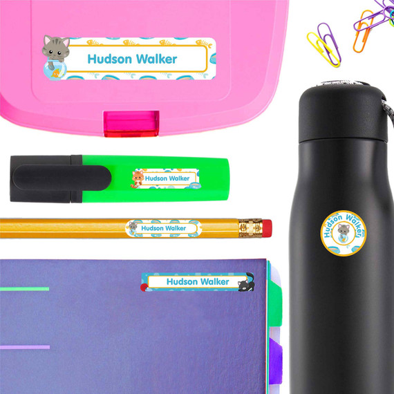 Kittens personalized name stickers on a school marker — waterproof labels for school supplies