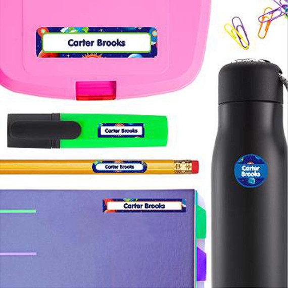 Cosmic Planets personalized name stickers on a school marker — waterproof labels for school supplies