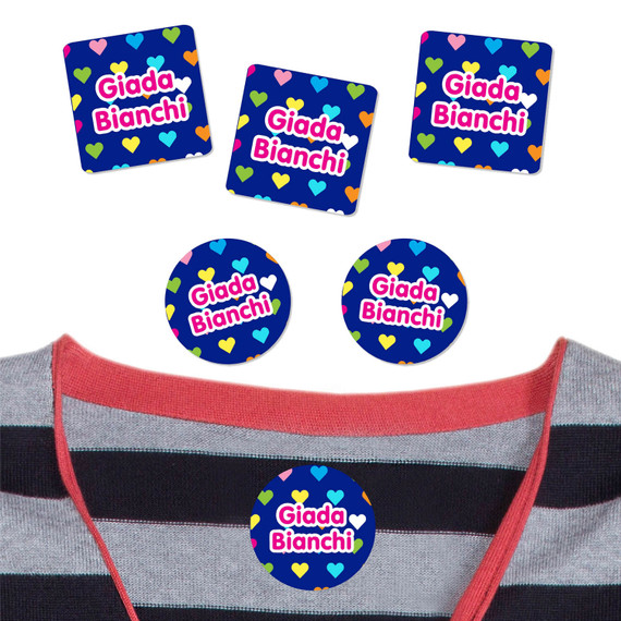 High-quality Hearts clothing stick on name labels on a t-shirt. Laundry-safe identification for daycare outfits.