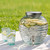2 Gallon Bee Quenched Glass Beverage Dispenser - 100% Recycled Glass with Infused Cucumber Lemon Water and Bee Glasses on Picnic Blanket at Park