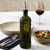 Olive Branch 16oz Recycled Glass Oil or Vinegar Bottle w/ Pour Spout Vintage Green with Salad and Wine at Restaurant 