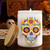 Assorted Sugar Skull Glass Jar w/ Lid, 12 oz, Glossy White with Bamboo Lid and Candle on Ofrenda