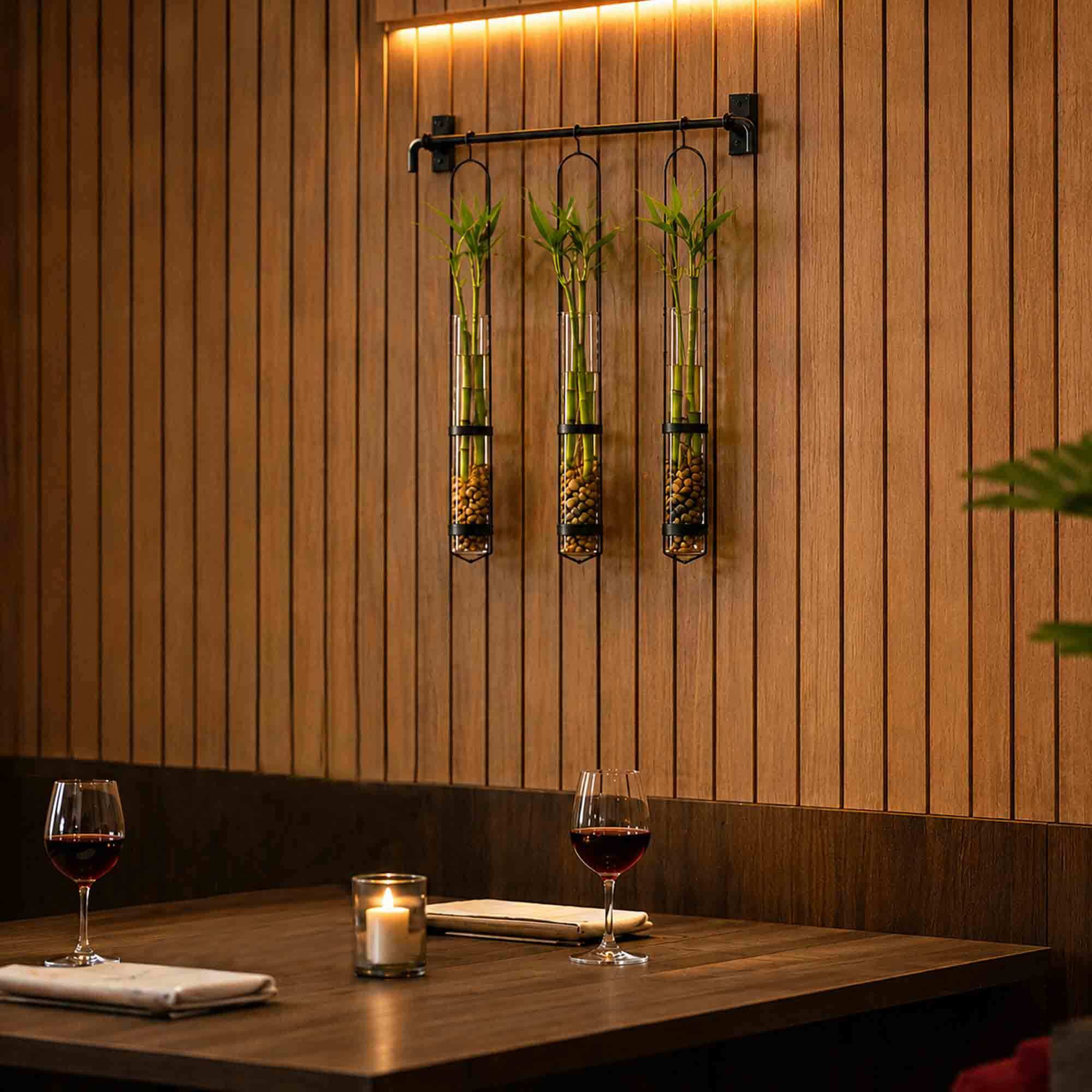 Campania Hanging Tube Pendant Vase with Bamboo and Pebbles in Fine Dining Restaurant Booth