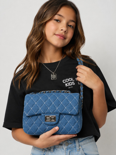 girls modeling Cool Kids Bklyn Junior Coco Quilted Denim Bag in Dark Blue with quilted denim texture and chain strap.