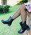 Stylish little girl wearing wide net black luxury fishnet tights with trendy fashion outfit by Cool Kids Bklyn.