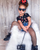 Stylish little girl wearing black medium luxury fishnet tights with trendy fashion outfit by Cool Kids Bklyn.