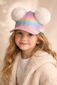 Girl wearing colorful pom pom cap, playful kids fashion accessory