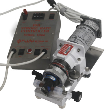 FMI QV valveless metering pump with RH1CTC ceramic pump head for laboratory chemical dosing