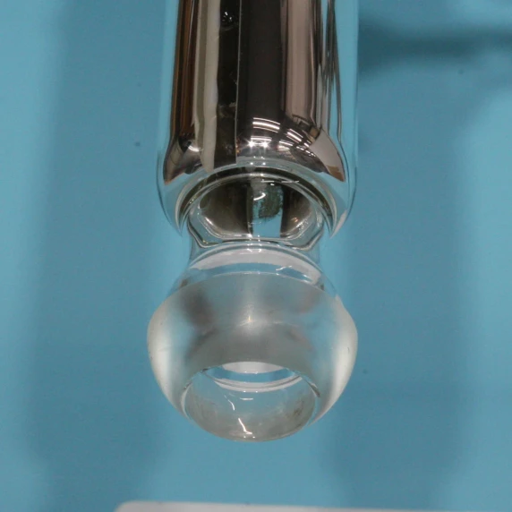 Close-up of the 50/32 spherical ball joint base providing structural flexibility on a glass distillation apparatus