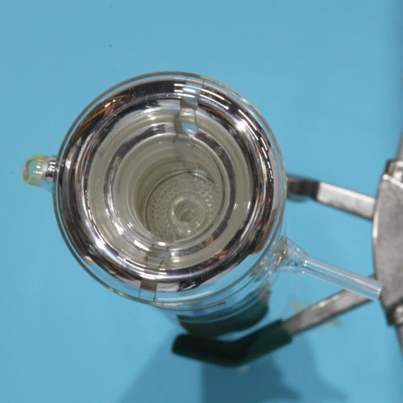 20 perforated plates and downcomers spaced one inch apart inside a borosilicate distillation column