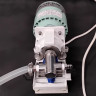 Fluid Metering Inc FMI QD valveless metering pump with R405 stainless steel pump head for precision laboratory fluid dosing