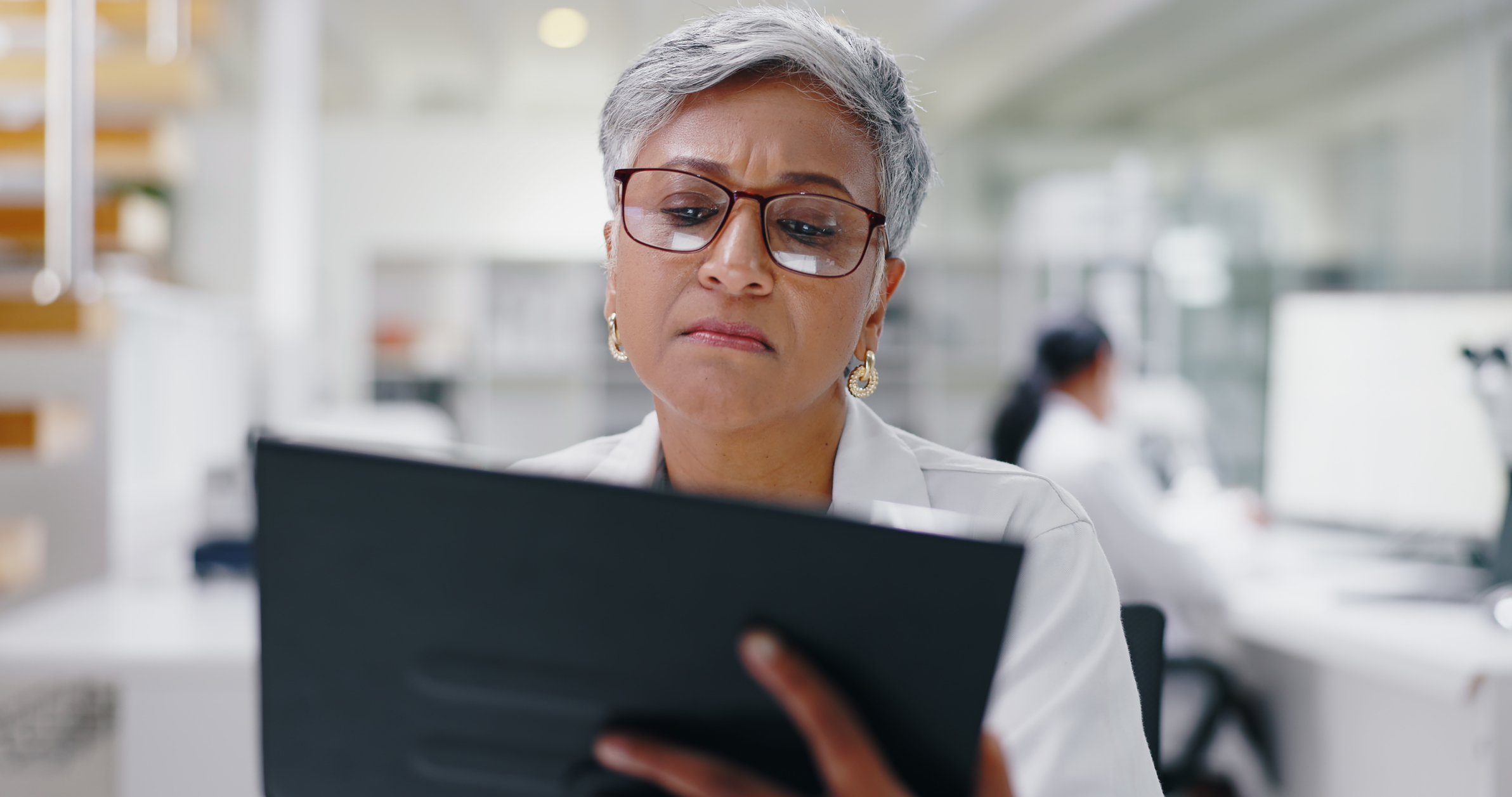 Scientist analyzing 2026 lab budget and equipment supply chain