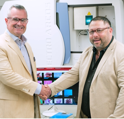 Chris Gaines and Erik Miller shaking hands at PURE