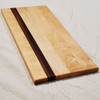 Solid maple and zebrawood cutting board