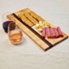 a little charcuterie and wine on a solid maple and zebrawood cutting board