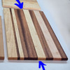 Solid Wood Edge Grain Cutting Board

24 1/4" Long x 12 13/16" Wide x 11/16" Thick

Constructed entirely of solid mahogany and maple wood