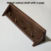 18 inch walnut shelf with 4 pegs