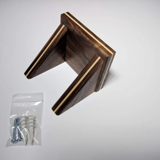 Solid walnut wood shelf with solid maple wood inlay shown with included screws and drywall anchors for easy installation with concealed fasteners