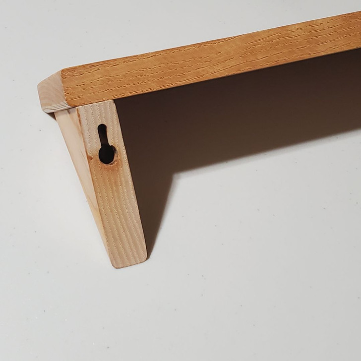 keyholes for easy concealed fastening in the back of the solid ash wood shelf