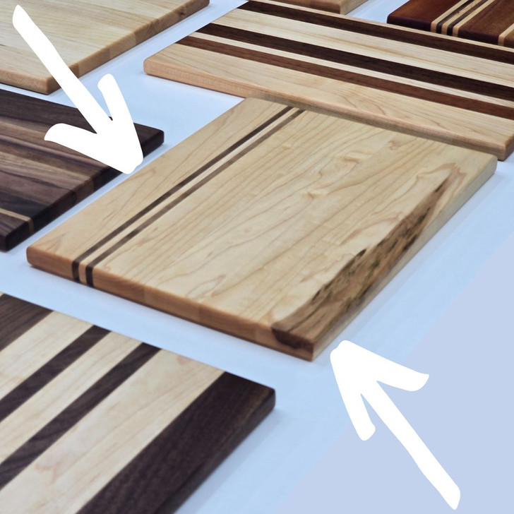 Solid Wood Edge Grain Cutting Board

12 7/8" Long x 9 15/16" Wide x 11/16" Thick

Constructed entirely of solid maple and walnut wood