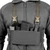 Front view of 1 pair of X type chest rig straps in Ranger Green worn on a man