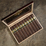 Carlos Torano Exodus Gold 1959 Toro Cigars 24 Count Box, open box showing 12 packed cigars with gold and green band labels on a textured surface.