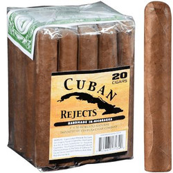 Cuban Rejects Robusto Natural 20Ct, box of 20 cigars with one cigar placed outside the box, showing the natural brown cigar wrapper. Cuban Rejects Robusto Natural 20Ct, box of 20 cigars with one cigar placed outside the box, showing the natural brown cigar wrapper.