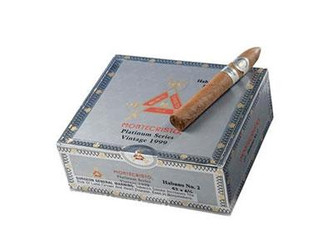 Montecristo Platinum No.3 Cigar Corona 27 Ct. Box 5.50X44, image showing a single cigar resting on an open box of Montecristo platinum cigars. Montecristo Platinum No.3 Cigar Corona 27 Ct. Box 5.50X44, image showing a single cigar resting on an open box of Montecristo platinum cigars.