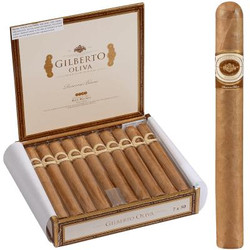 Gilberto Oliva Reserva Blanc Cigar Churchill 20 Ct. Box 7.00X50, opened wooden box displaying 20 cigars with a single cigar shown outside the box. Gilberto Oliva Reserva Blanc Cigar Churchill 20 Ct. Box 7.00X50, opened wooden box displaying 20 cigars with a single cigar shown outside the box.