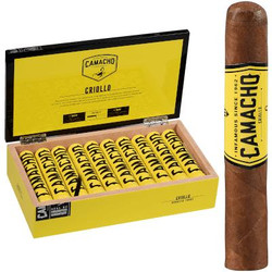 Camacho Criollo Cigar Robusto Tubo 20 Ct. Box, featuring a box of 20 cigars with yellow and black packaging and a single cigar standing upright displaying its band. Camacho Criollo Cigar Robusto Tubo 20 Ct. Box, featuring a box of 20 cigars with yellow and black packaging and a single cigar standing upright displaying its band.
