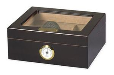Quality Importers Humidors Capri Glass Top Cigar Humidor, a black wooden humidor with a glass lid and a hygrometer on the front for optimal cigar storage. Quality Importers Humidors Capri Glass Top Cigar Humidor, a black wooden humidor with a glass lid and a hygrometer on the front for optimal cigar storage.