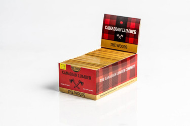 Canadian Lumber The Woods Rolling Papers 1 1/4 With Filters, packaged in a red and black checkered box containing 22 packs of rolling papers. Canadian Lumber The Woods Rolling Papers 1 1/4 With Filters, packaged in a red and black checkered box containing 22 packs of rolling papers.