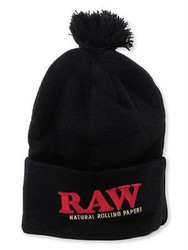 RAW Rolling Papers X Raw Knit Hat Black, black knitted beanie with a pom-pom on top and a folded cuff featuring the red RAW logo.