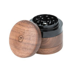 Marley Natural Wood Grinder Small, compact round wooden herb grinder with a black interior.