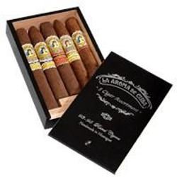 La Aroma de Cuba & San Cristobal Cigar Sampler 5Ct, box of five cigars with detailed band designs inside a sleek black presentation box. La Aroma de Cuba & San Cristobal Cigar Sampler 5Ct, box of five cigars with detailed band designs inside a sleek black presentation box.