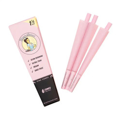 Blazy Susan Pre-Rolled Cones 1 1/4 6Pk Pink, set of six pink pre-rolled cones with packaging showing product details and branding. Blazy Susan Pre-Rolled Cones 1 1/4 6Pk Pink, set of six pink pre-rolled cones with packaging showing product details and branding.