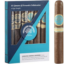 Montecristo H. Upmann Cigars by AJ Fernandez 6ct Sampler, box of cigars with detailed labels and a single cigar outside the box showcasing the branding and packaging.