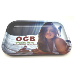 Republic Group OCB Premium Rolling Tray, a metal tray featuring an image of a woman with long hair, holding a joint, and the brand's logo and product description on the surface. Republic Group OCB Premium Rolling Tray, a metal tray featuring an image of a woman with long hair, holding a joint, and the brand's logo and product description on the surface.
