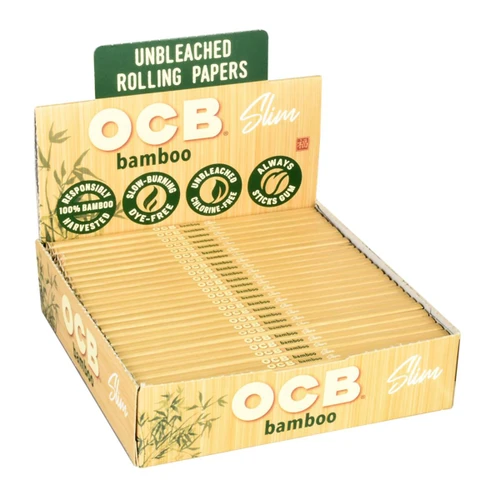 OCB Bamboo Cigarette Papers Slim Plus Tips, cardboard box containing slim unbleached bamboo rolling papers with green and beige packaging design.