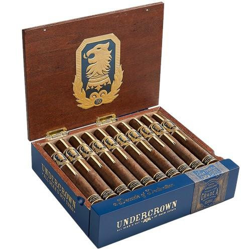 Undercrown 10 by Drew Estate Cigars, a wooden cigar box filled with neatly arranged cigars featuring gold and black labels, open to display the logo on the inside lid.