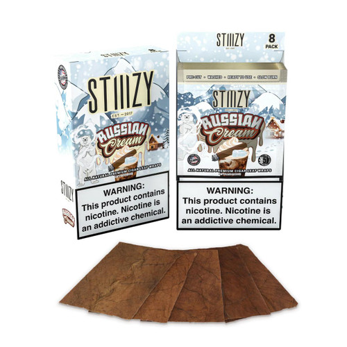Stiiizy Natural Cigar Leaf Wraps 8/5, packaged cigar wraps with an illustration of a polar bear in a winter scene and several wrapped cigars displayed below.