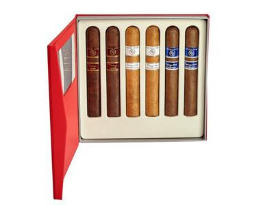 Rocky Patel Vintage Cigar Sampler 6Ct, a box containing six assorted cigars with different shades and band designs, presented in a red box with a white interior.