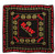 RAW Scarf Black, a stylish black scarf with red and gold branding and circular logo patterns.