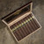 Carlos Torano Exodus Gold 1959 Toro Cigars 24 Count Box, open box showing 12 packed cigars with gold and green band labels on a textured surface.
